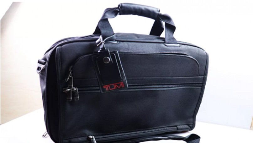 Genuine black Tumi travel bag in black Canvat fabric
